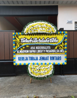 Papan Bunga Duka di Bilah Barat